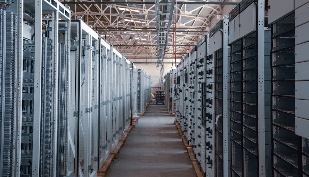 Rows of server and equipment racks in a data centre aisle