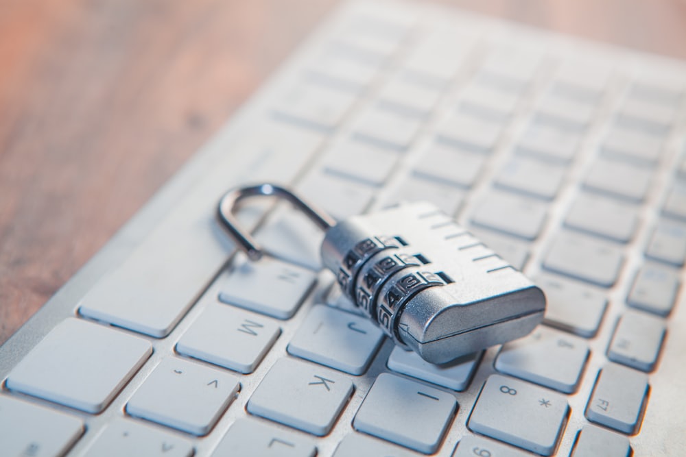 Combination padlock resting on a computer keyboard